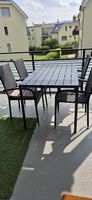 Schwarzer Gartentisch mit 4 Stühlen