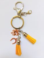 Auto-Schlüsselanhänger mit Quasten und CHARMS GELB-ORANGE