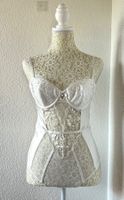 White lace corset body with adjustable straps and bow detail