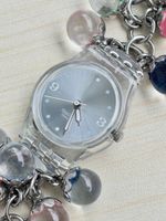 Swatch Damenuhr mit Glasperlen Armband silberfarben