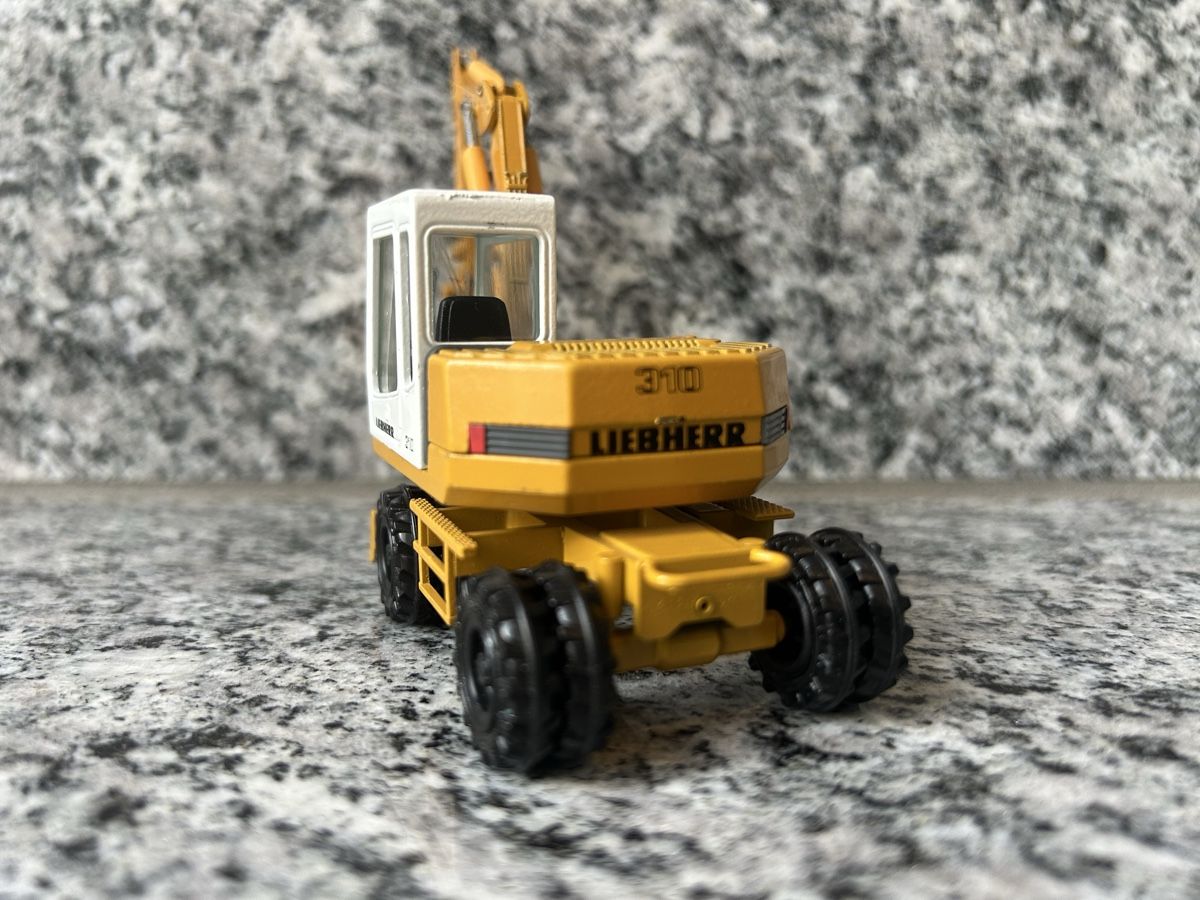 Liebherr Excavateurs: Liebherr 310 , 1:50 , Conrad – D'occasion à Horw par Tigercat635 2