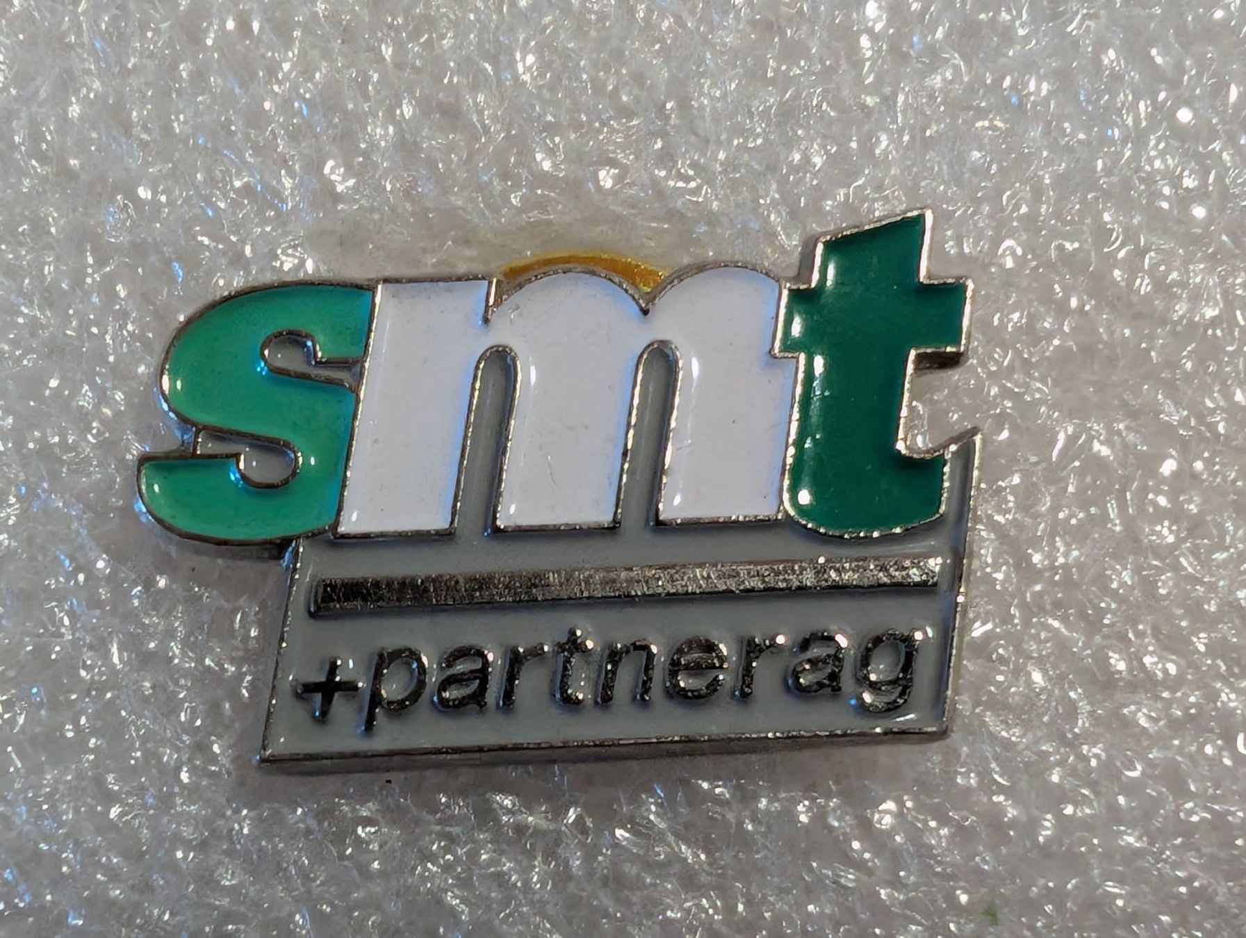 Placchette & Badge: Ansteckpin 277: smt & Partner AG – Usato da Oppligen venduto da Pin-Fall-Shop
