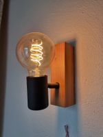 Wandlampe Holz mit schwarzem Lampenschirm von Eglo
