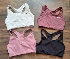 4 Sport-BHs Nike Grössen XS und S