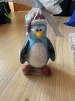 Herziger Pinguin als Kerze