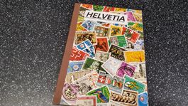 Briefmarkenalbum Helvetia mit vielen Schweizer Marken