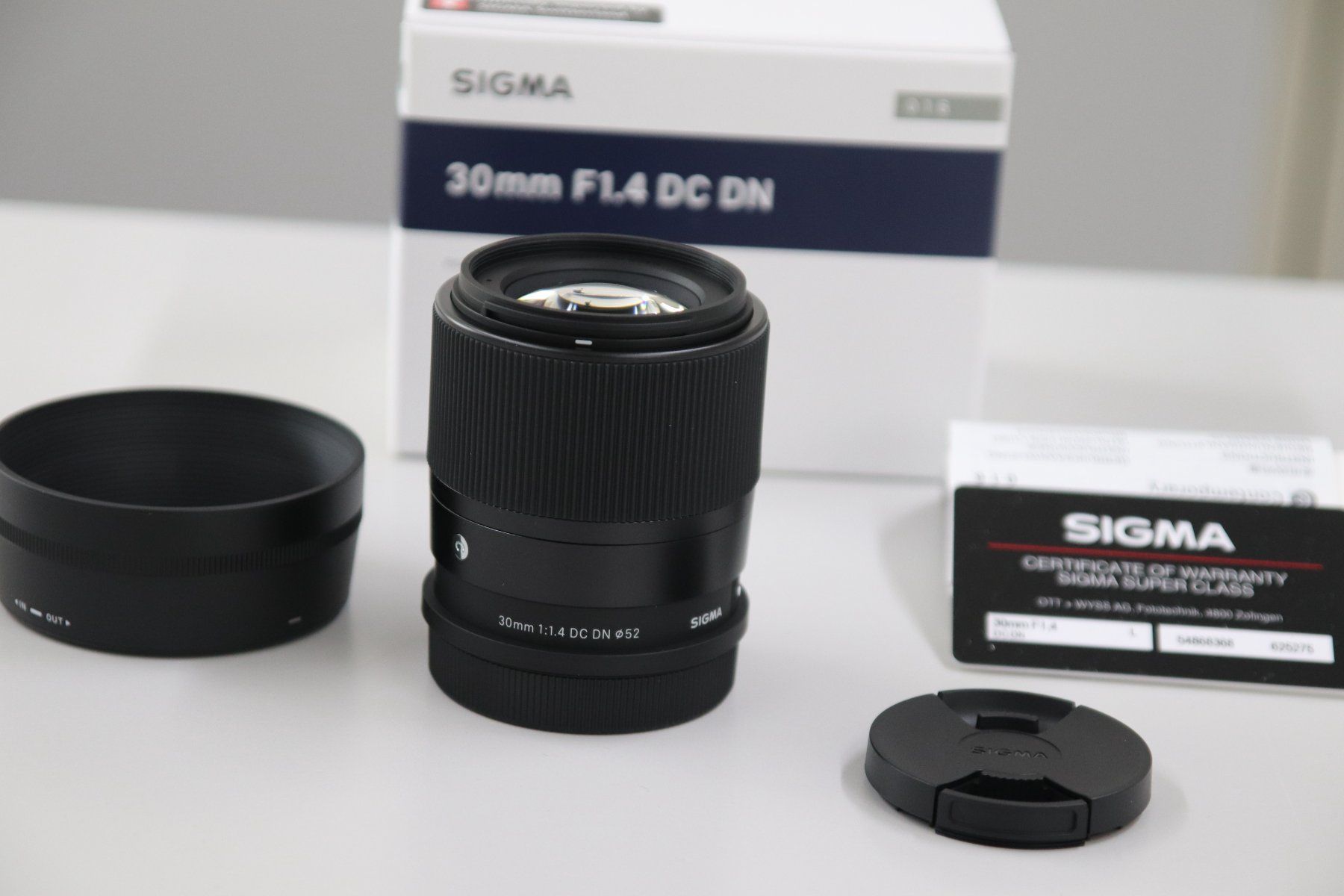 Sigma Obiettivi: Sigma 30mm 1.4 DC DN L-Mount / NEU – Nuovo e nell'imballaggio originale da Zofingen venduto da OWYSSAG