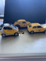 Drei Spielzeugautos / PTT