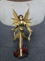 Figurine fée ailes dorées robe verte