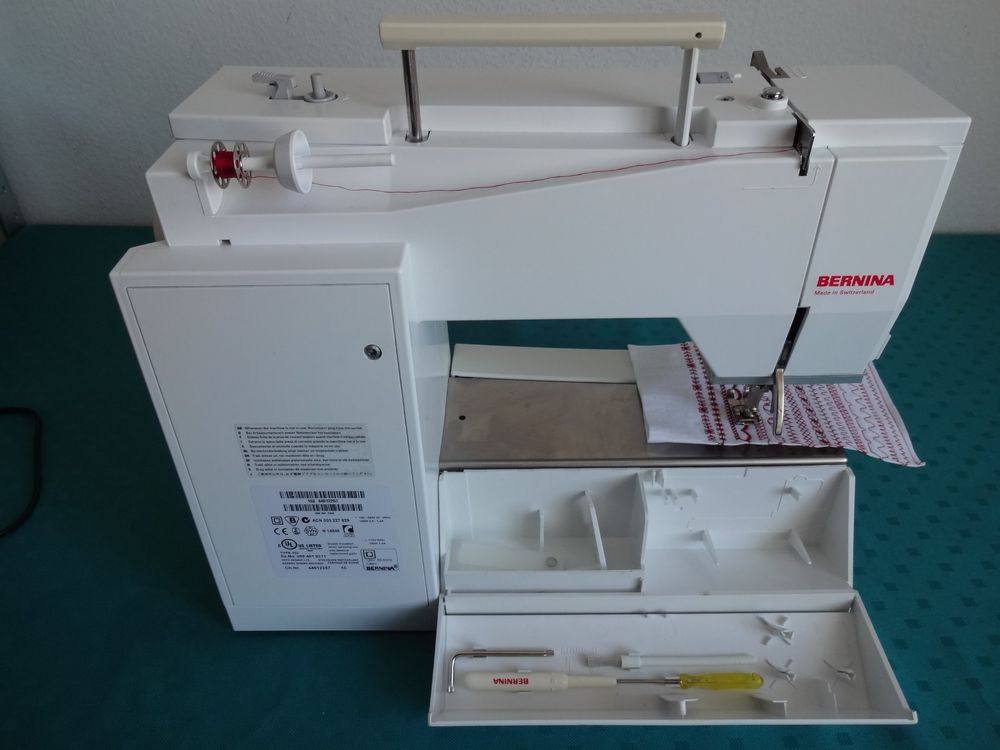 A BERNINA VIRTUOSA 163 SEWING MACHINE WITH CARRY CASE AND ACCESSORIES - SOLD AS SEEN