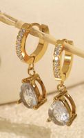 Elegante goldene Ohrringe mit Zirkonia-Tropfen, neuwertig