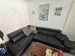 Schwarzes Ecksofa mit Schlaffunktion und Bettkasten