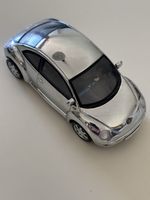 Voiture miniature   VW New Beetle 1:43 chrome état neuf
