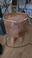 Stool cowhide brown with wooden legs good condition
