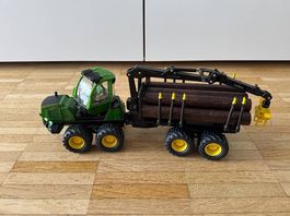 Traktor mit Anhänger und Baumstämmen  Occasion