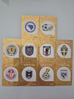 10 Wappen Paninis WM 2026