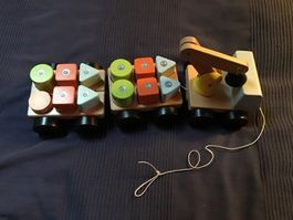 Holzfahrzeug mit Steckspiel und Kran gebraucht