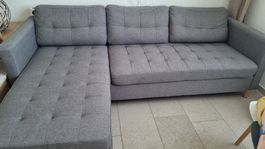 Ecksofa mit Stoffbezug in grau, gut erhalten