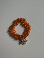 Orange Perlen Ring mit Blumen Anhänger