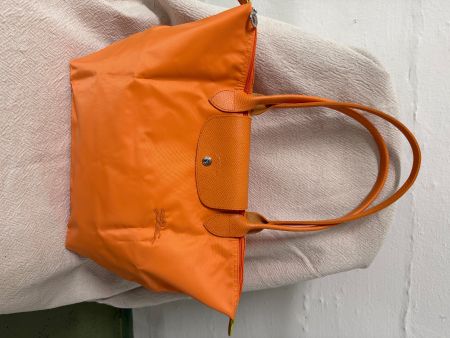 Schöne orangefarbene Longchamp Tasche, perfekt für den So...