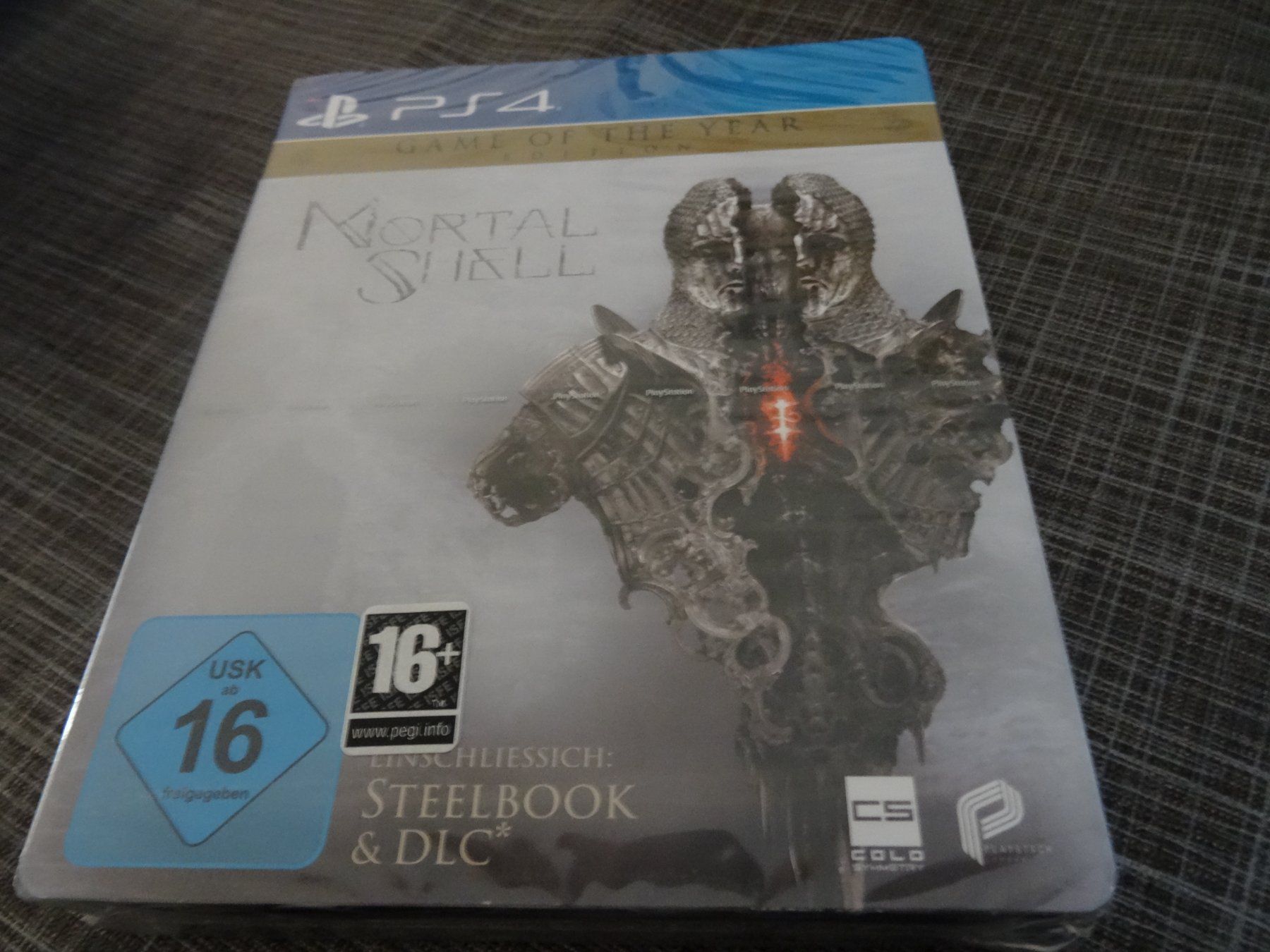 Giochi: Mortal Shell - Enhanced Edition PS4 NEUWARE – Nuovo e nell'imballaggio originale da Olten venduto da Disc-Ausverkauf