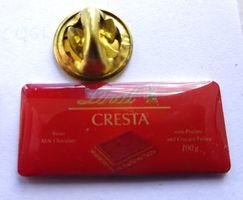 Pin Schokolade Lindt CRESTA rot