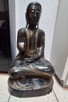 Buddha Figur schwarz goldglitzernd sitzend