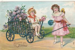 2 Kinder mit Blumenwagen