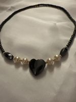 Herzkette. Collier mit Perlen und Onyx