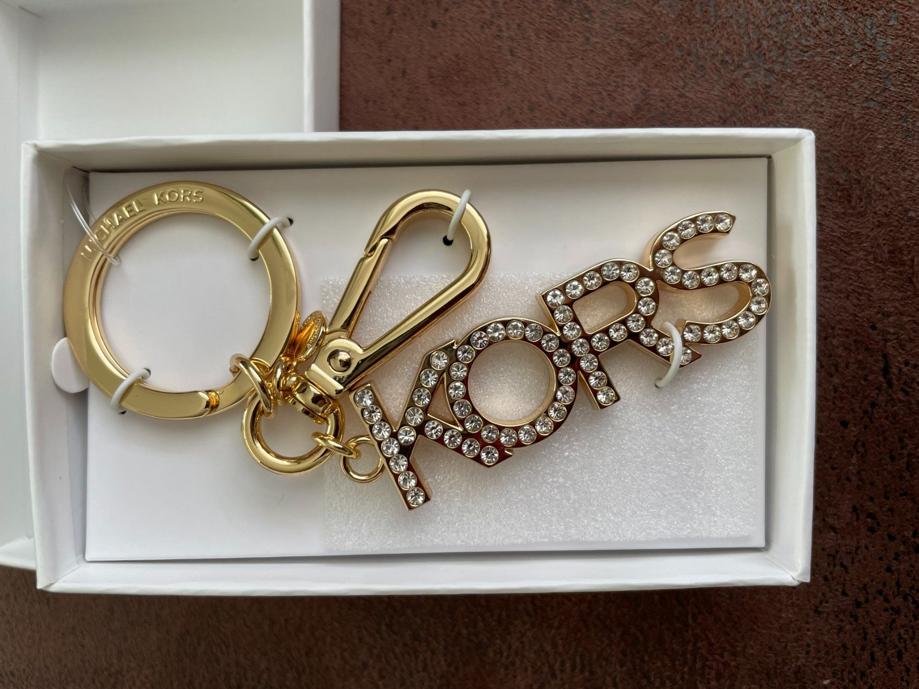 Michael Kors Portachiavi: MICHAEL KORS SCHLÜSSELANHÄNGER GOLD – Nuovo e nell'imballaggio originale da Kaiseraugst venduto da tombstonemarshal