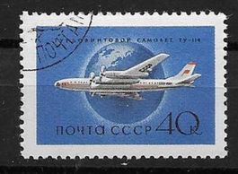 Sowjetunion 1958: Flugzeug Tupolew Tu-114 vor Erdkugel