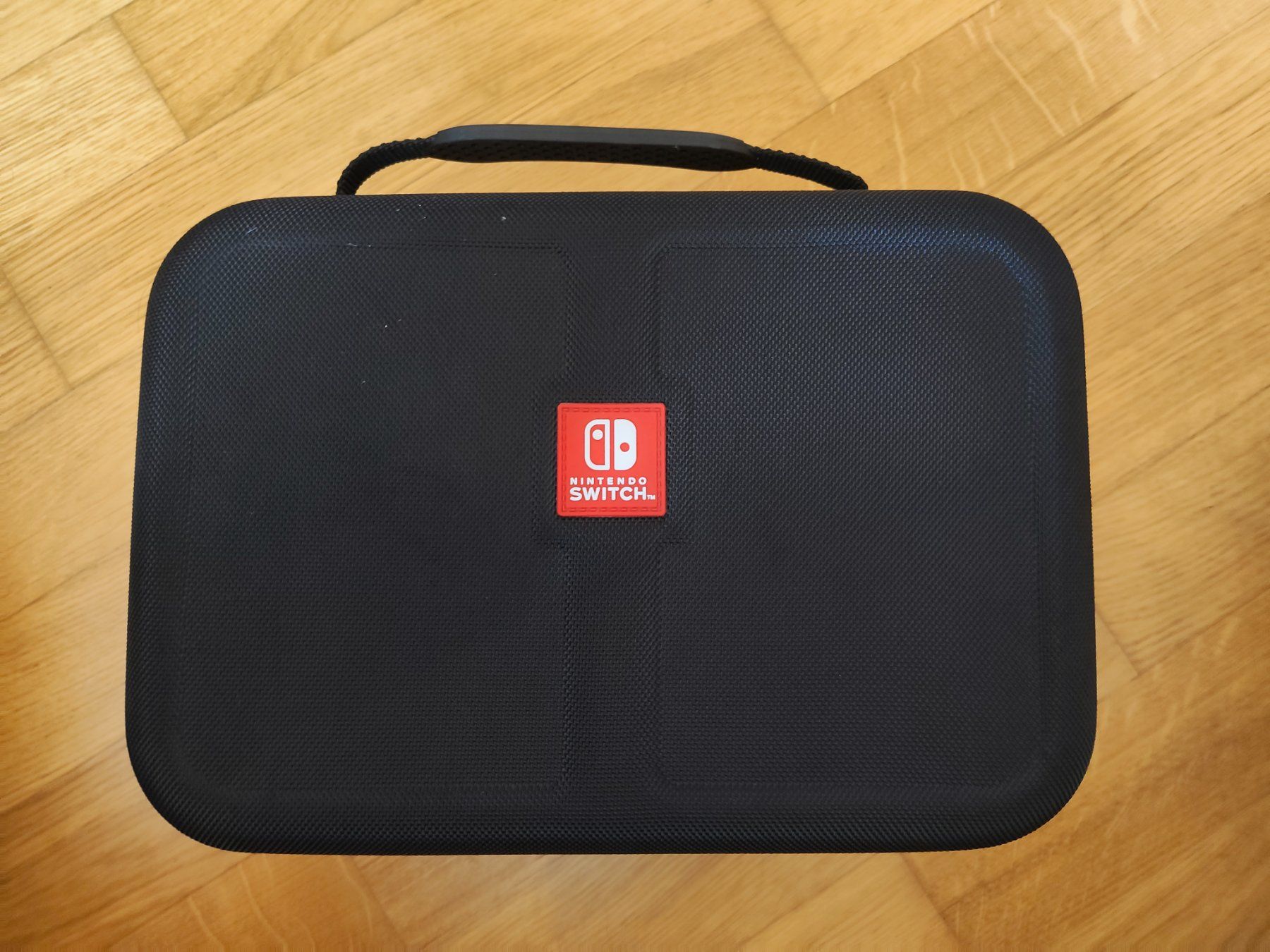 Nintendo Consoles: Nintendo Switch Reisetasche Hardcase mit Griff – Neuf (Voir description) à Niederrohrdorf par MystoganZ