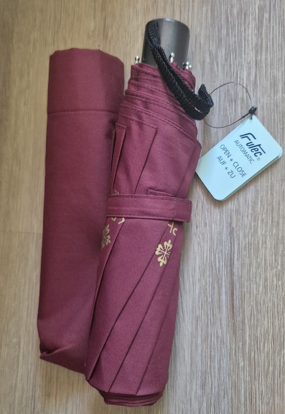Patek Philippe Orologi: Parapluie pliable automatique bordeau, Patek Philippe  – Nuovo e nell'imballaggio originale da Plan-les-Ouates venduto da geg_5zl5