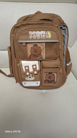 Brauner Unisex-Rucksack mit Wasserschweinmotiv