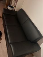 Schwarzes Ledersofa