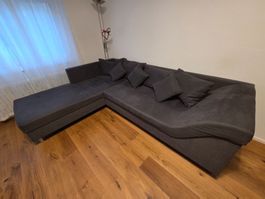 Divano angolare grigio scuro con cuscini - Affare d'autunno!