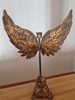 Kerzenständer mit Flügeln