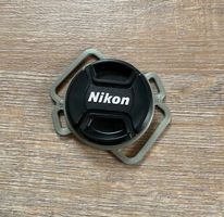 Nikon Schutzkappen Halter