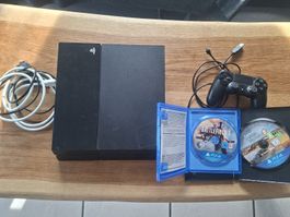 PlayStation 4 Konsole schwarz mit Controller und 2 Spielen