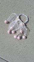 rosa Haargummi mit glitzer Pom Pons
