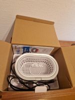 Emag Ultraschallreiniger mit Reinigeprodukte