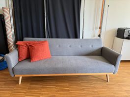 Graues Bettsofa inklusive Kissen
