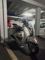 Sym mio 100