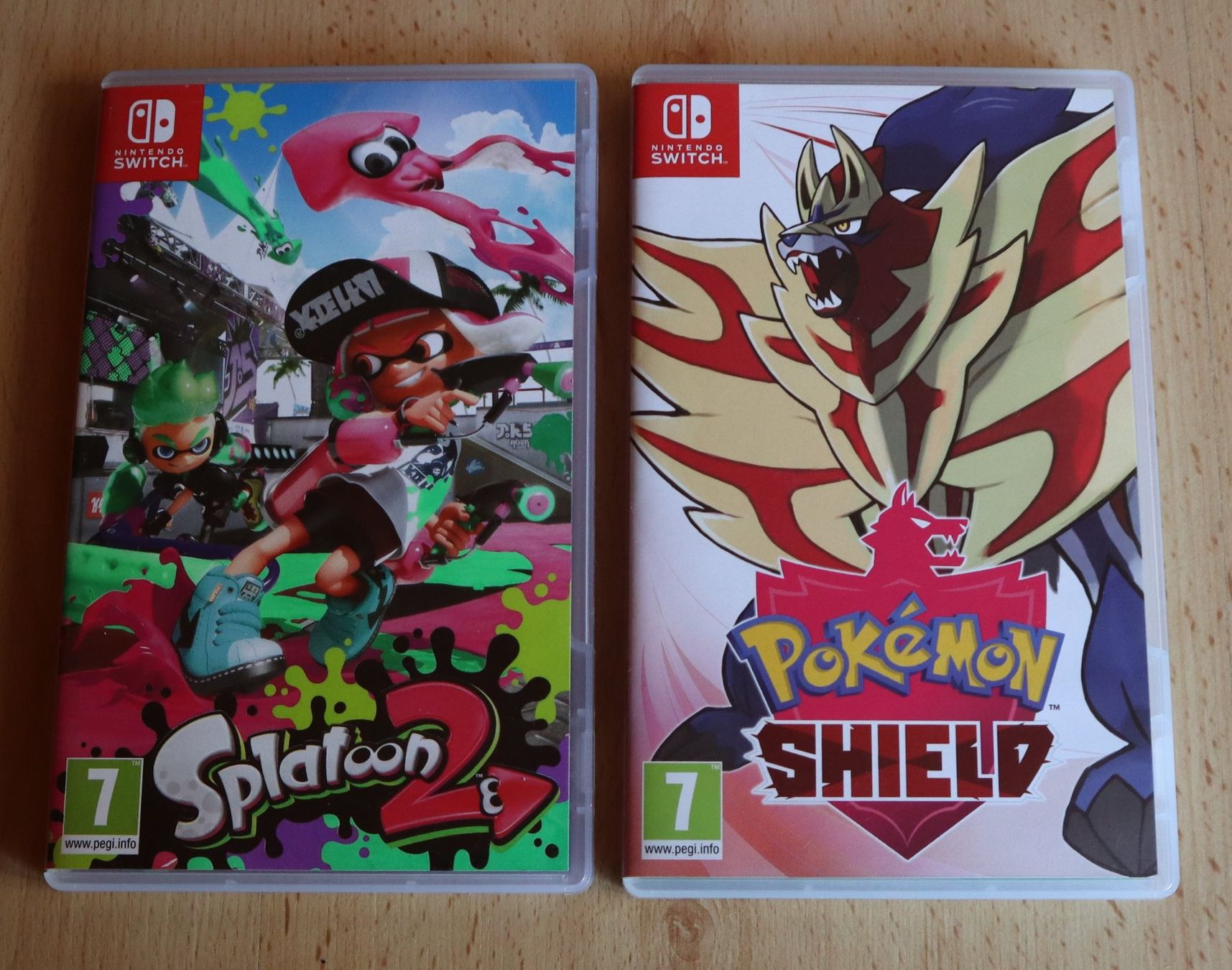 Nintendo Jeux: SPLATOON 2 & PoKéMoN SHIELD ---  Top Games im Doppelpack – D'occasion à Ochlenberg par on3x
