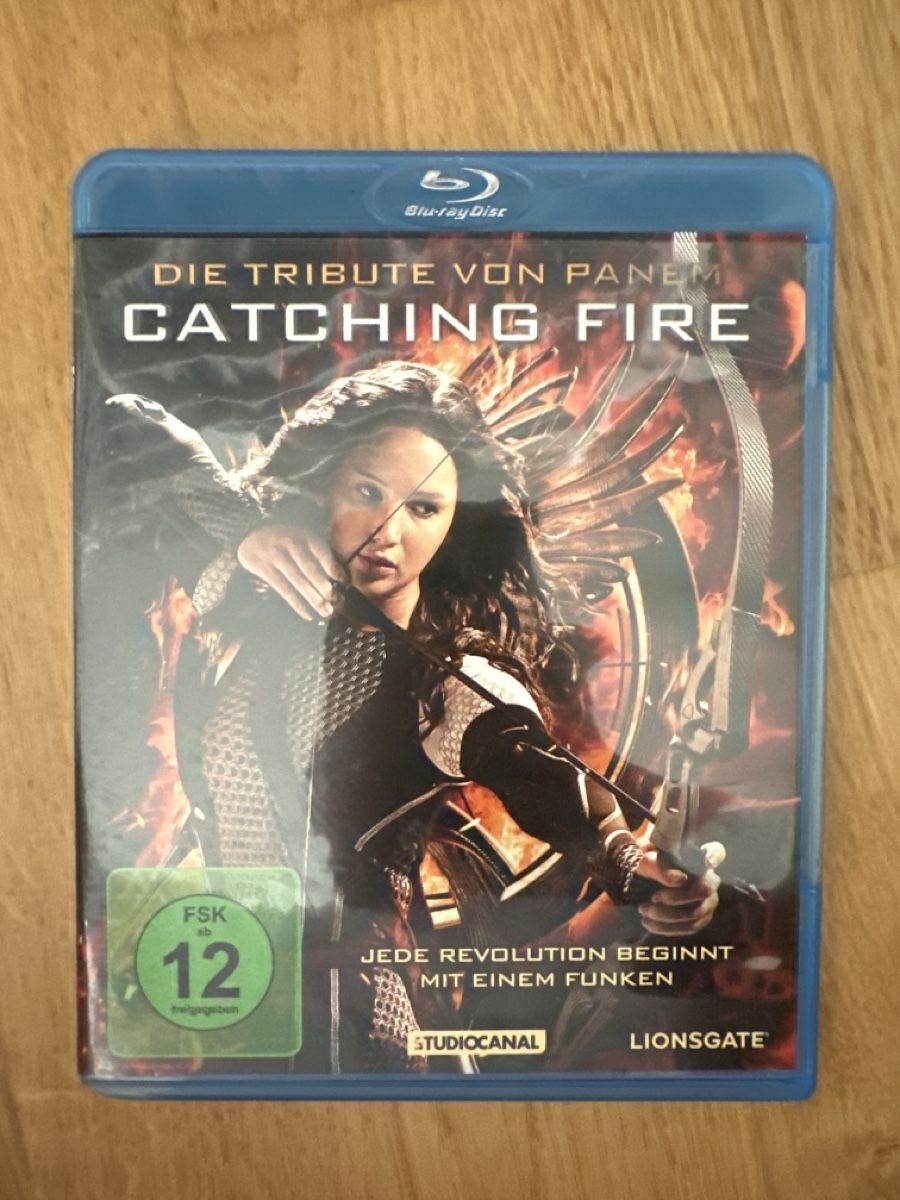 Tutti i DVDs: Die Tribute von Panem: Catching Fire Blu-ray – Nuovo (secondo la descrizione) da Hochdorf venduto da Blitzman83