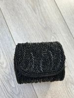 Petite pochette à paillettes noir