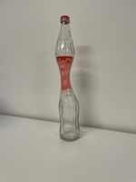 Coca Cola Flasche gebogen