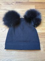 Cappello in maglia con doppio pompon
