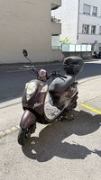 Sym Mio 100 + coffre, airbag, 2 casques, gants, ++
