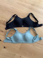 2 Sport-BHs Under Armour schwarz und grün, gebraucht